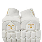 Castle white and gold batting gloves showing wrist cuffs and back-of-hand padding
